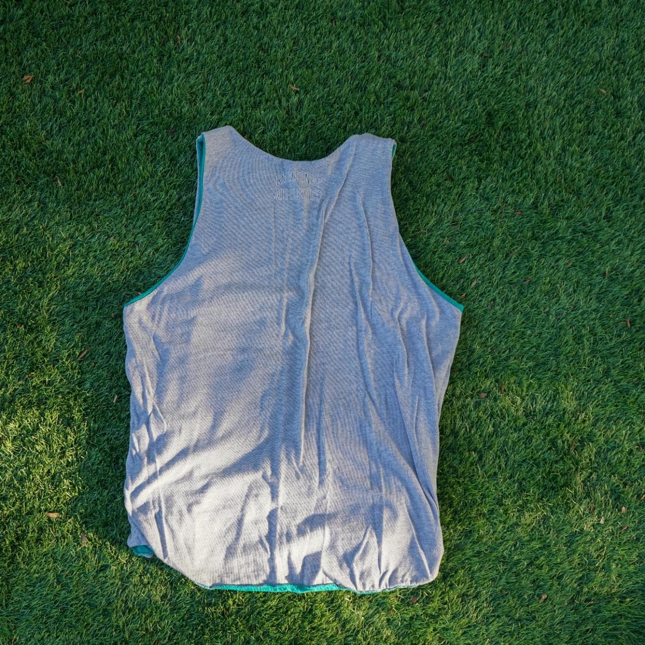 Vintage Russell Athletics reversible tank in teal and gray. Fits like an adult Large. Features graphics on both sides, with a logo tag, and a brand patch. - Thumbnail 2