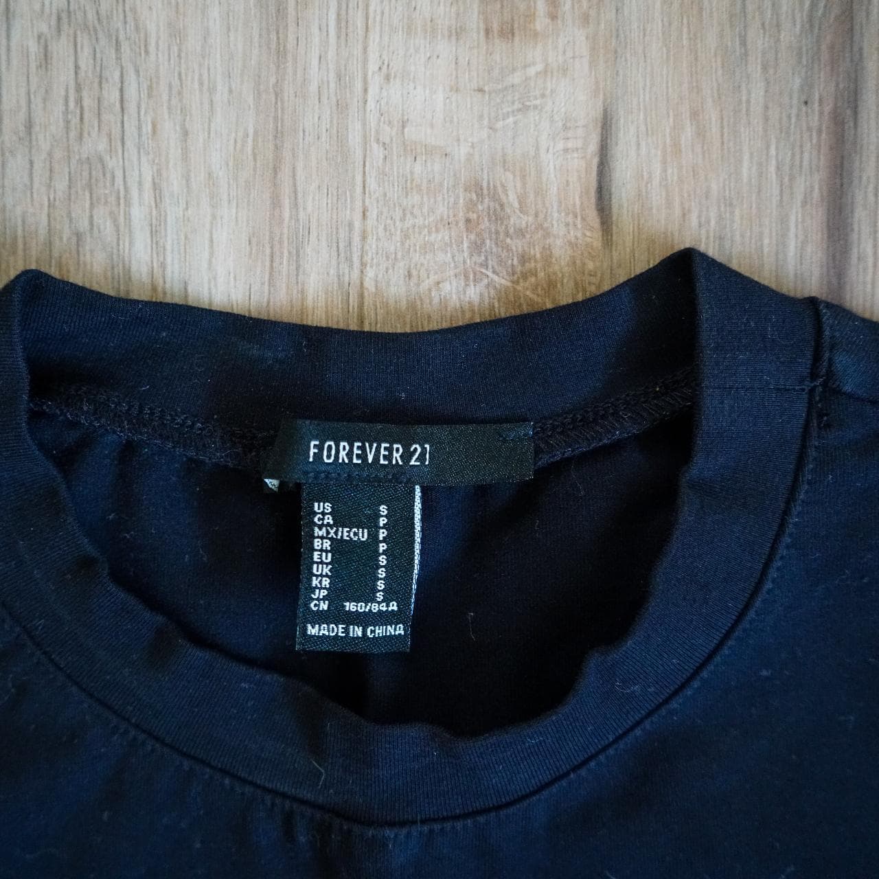 Fantasy crop top in black with holographic text. Stretchy fabric, women's size small. - Thumbnail 3