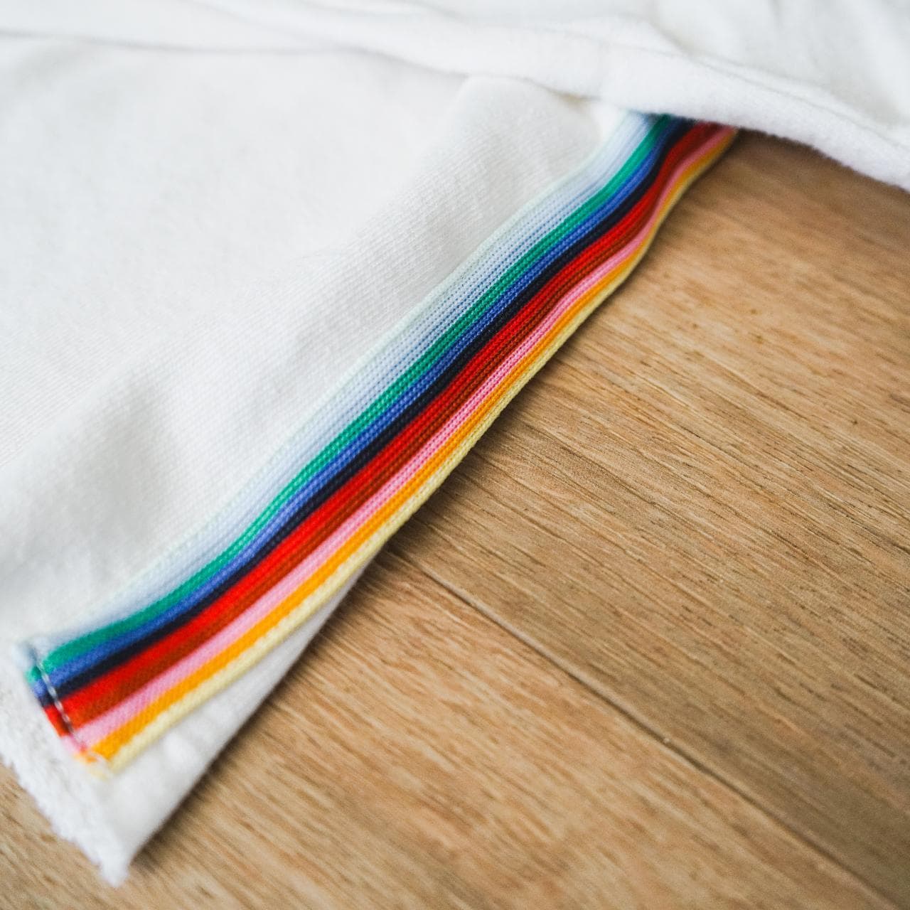 Cropped white pullover sweatshirt with rainbow accent stripe. A simple crop that can be dressed up or down. Women's size small 🌈 - Thumbnail 2
