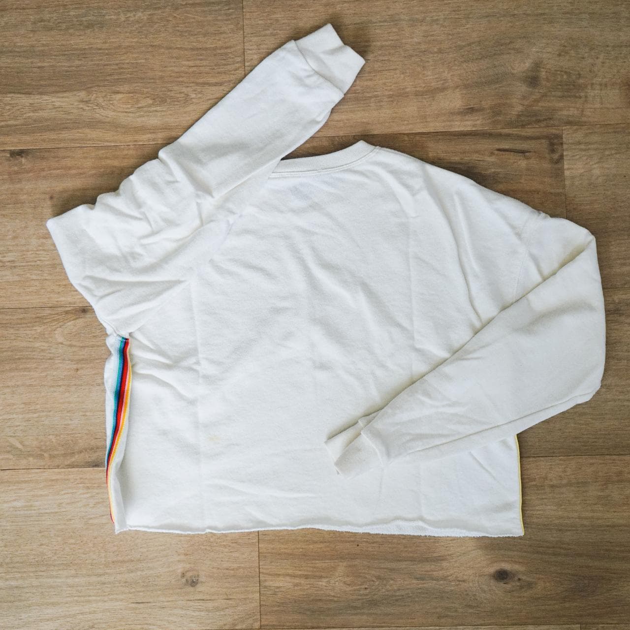 Cropped white pullover sweatshirt with rainbow accent stripe. A simple crop that can be dressed up or down. Women's size small 🌈 - Thumbnail 4