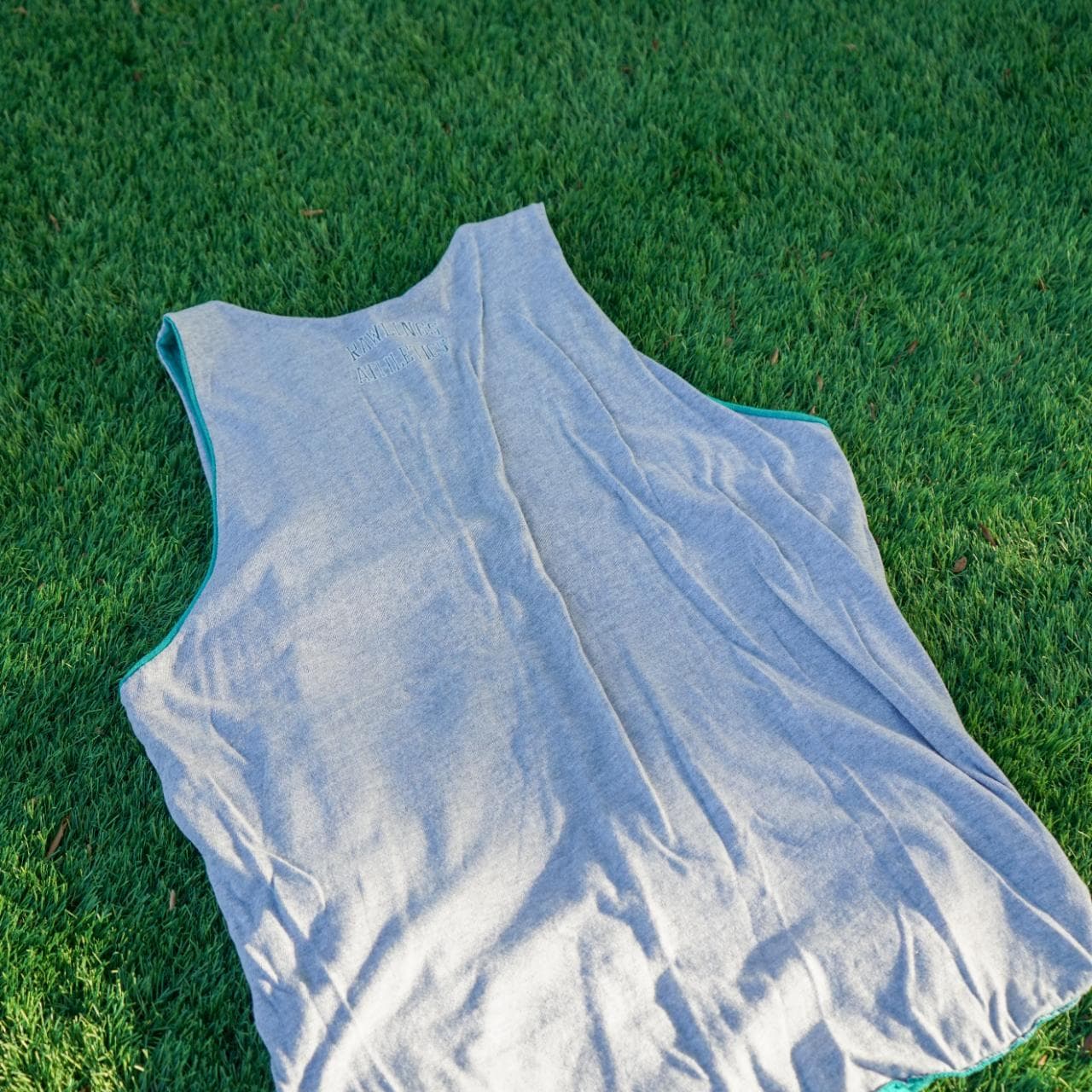 Vintage Russell Athletics reversible tank in teal and gray. Fits like an adult Large. Features graphics on both sides, with a logo tag, and a brand patch. - Thumbnail 3