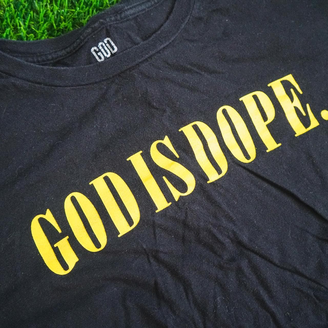 Atlanta indie brand, "God Is Dope" tee in black with yellow text. Features graphic on front and torn hem. Size adult large 🙏