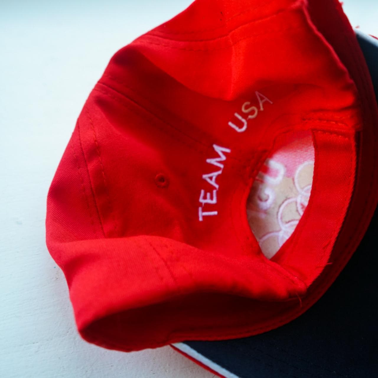 Adjustable #TeamUSA #Olympic hat in red with "team USA" text on back. Navy under brim with white bill trim. - Thumbnail 2