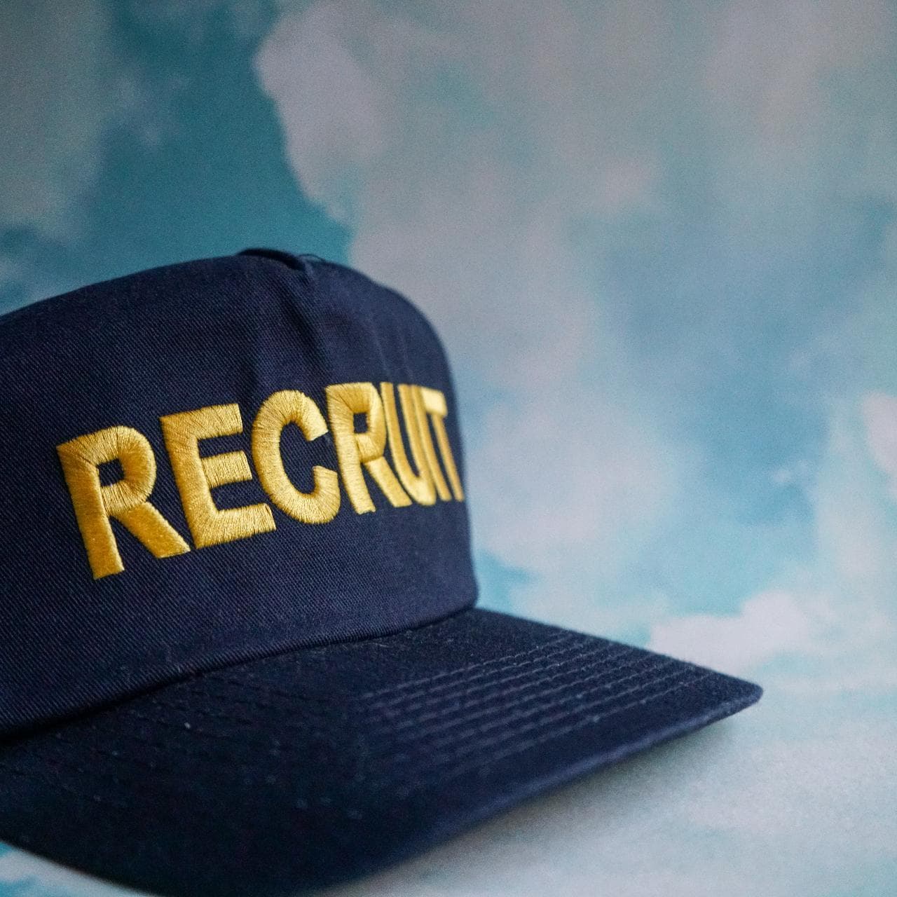 Police "Recruit" hat in black and yellow. Features a structured A-frame dome and adjustable snap closure. One size fits all 🧢 - Thumbnail 2