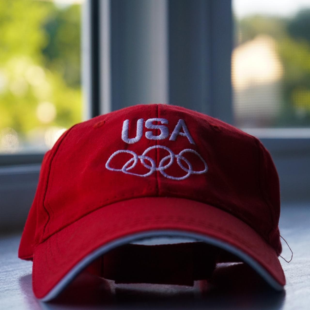 Adjustable #TeamUSA #Olympic hat in red with "team USA" text on back. Navy under brim with white bill trim.