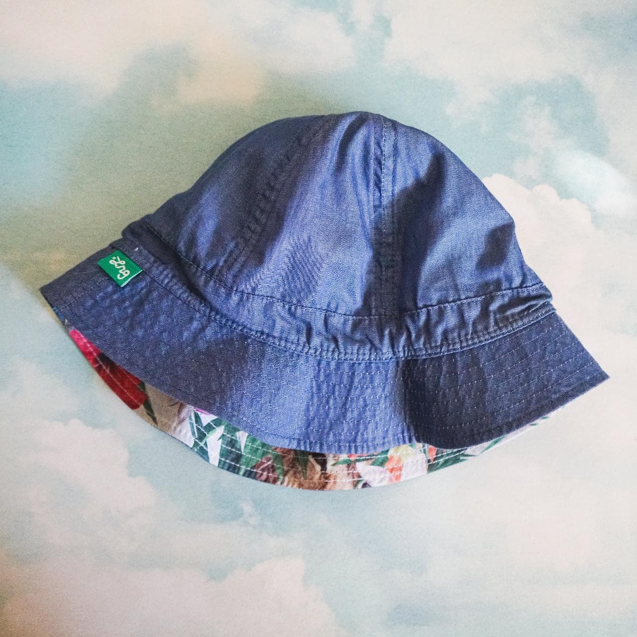 Crazy #LRG reversible bucket hat. Features medium-washed denim on one side with logo tag and full-color tropical print on the other side. The Y2K style is back and this accessory is perfect for the Summer 🌲 - Thumbnail 4