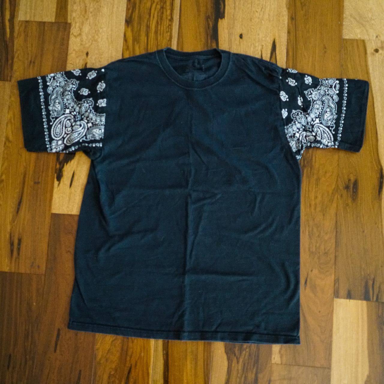 Black hand-sewn bandana tee in an adult medium. Bandana sleeves feature an all-over print.