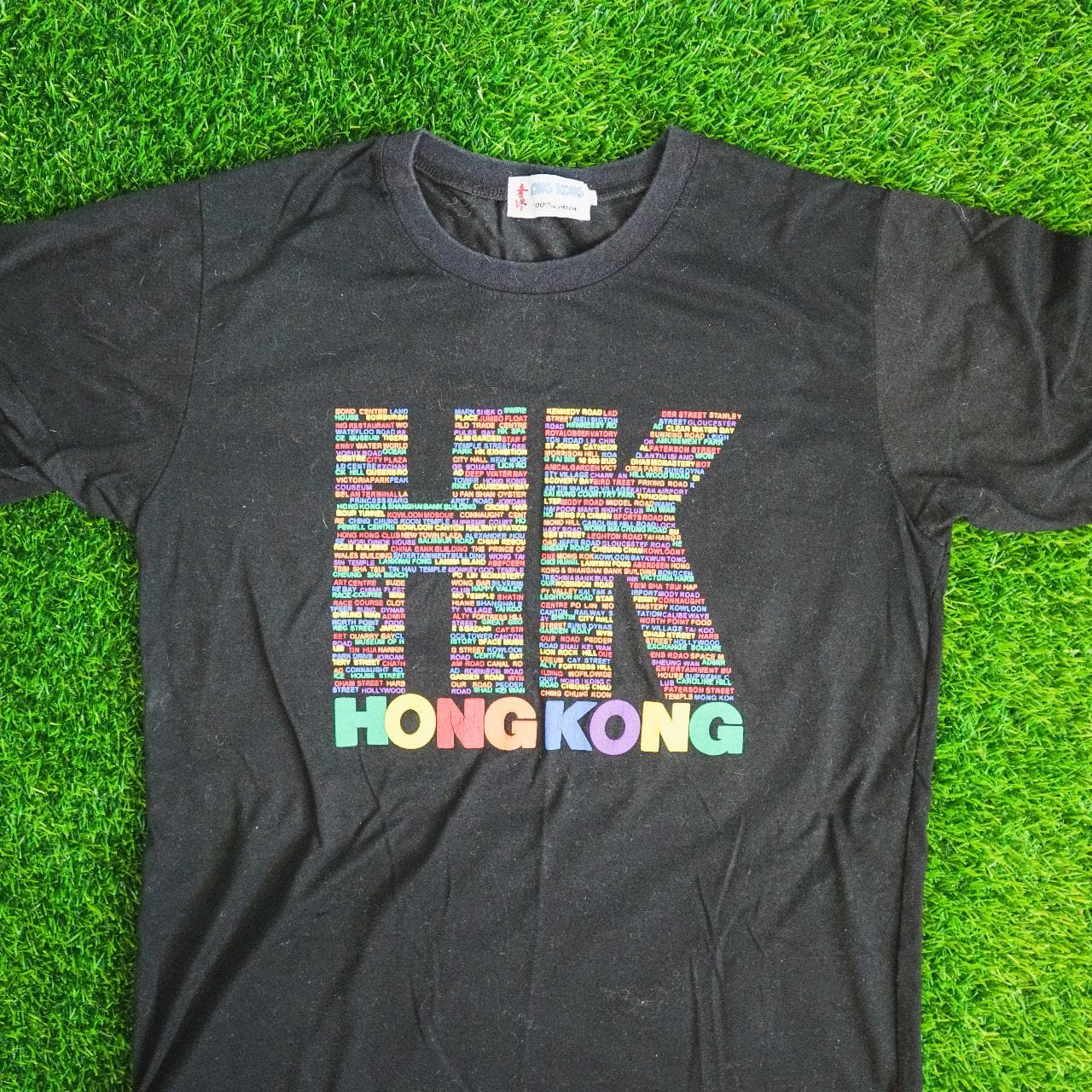 HONG KONG logo tee in black with multicolored print. Features raised puff print. Asian adult size large, fits more like a medium 🔋
