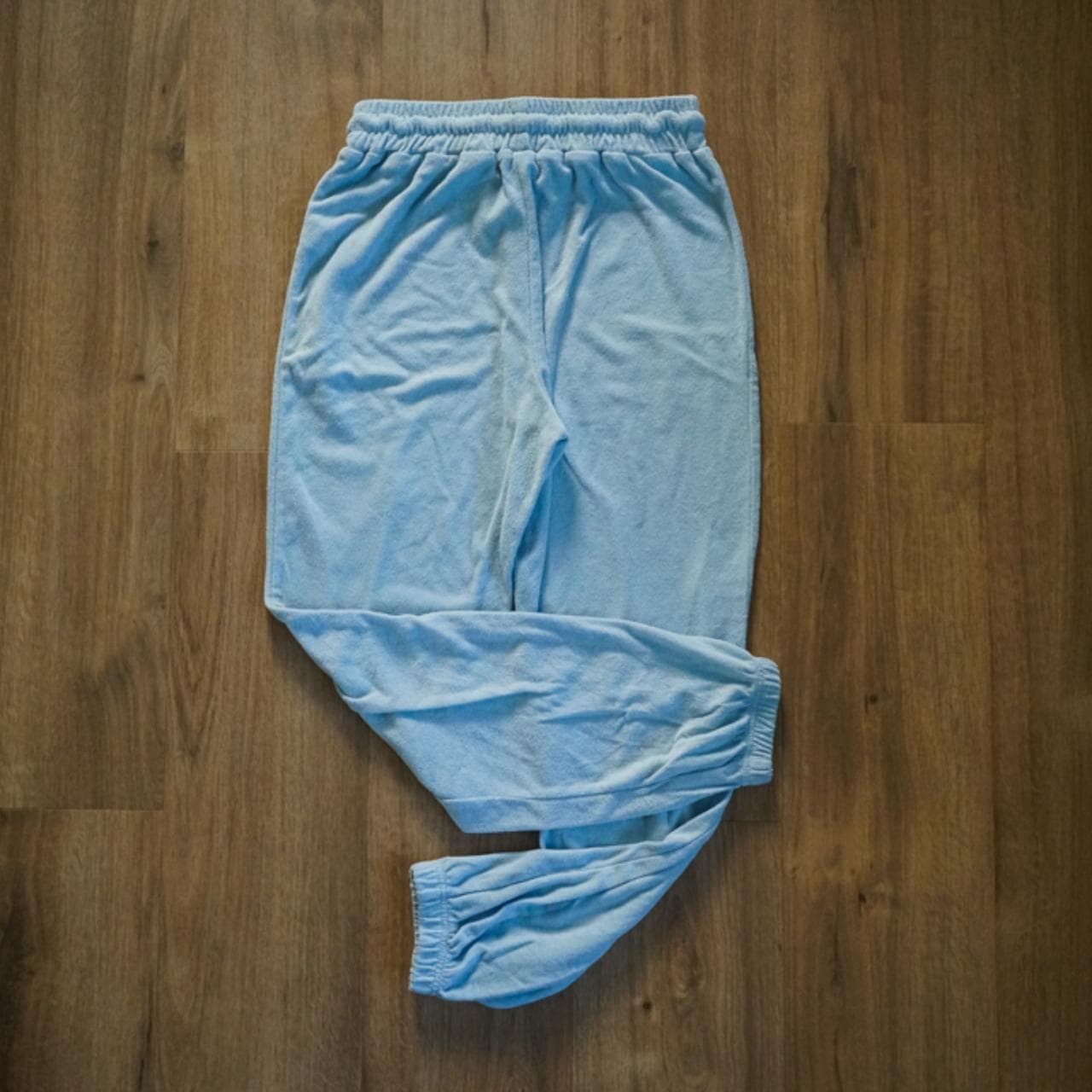 Light blue #terrycloth sweatpants with adjustable metal tipped drawstring. Jogger style ankle with pockets on the front. - Thumbnail 3