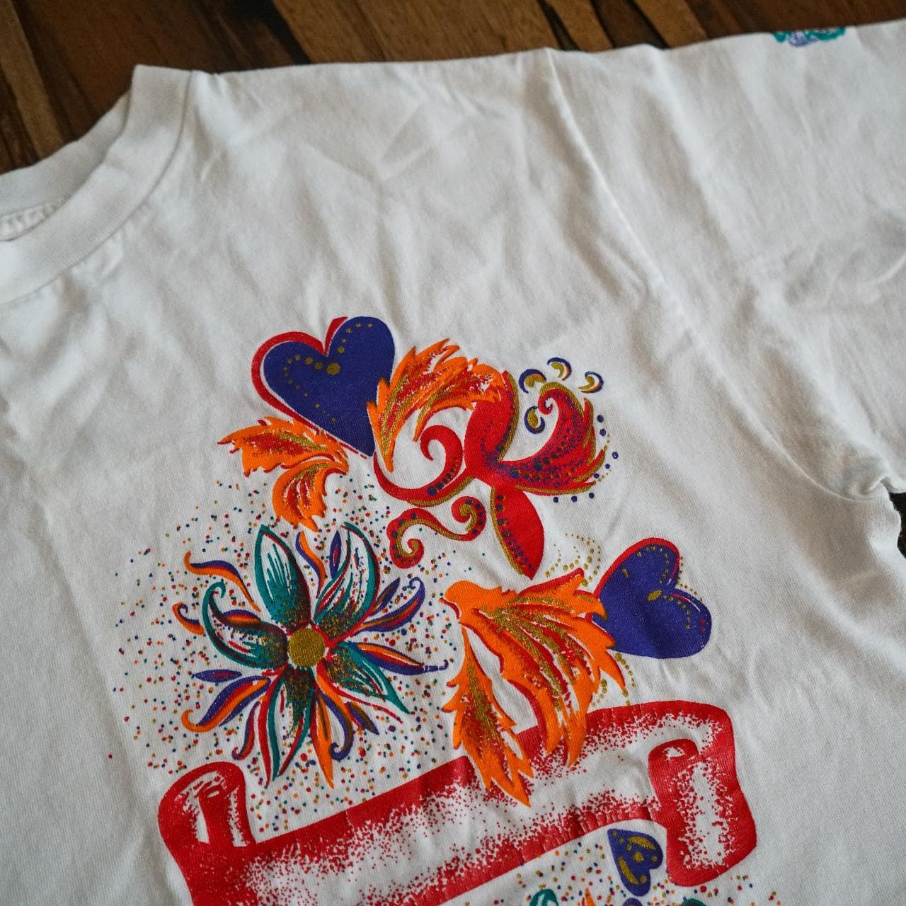 One size fits all vintage oversized tee with festival graphic on front. Additional color print on one sleeve 🐔