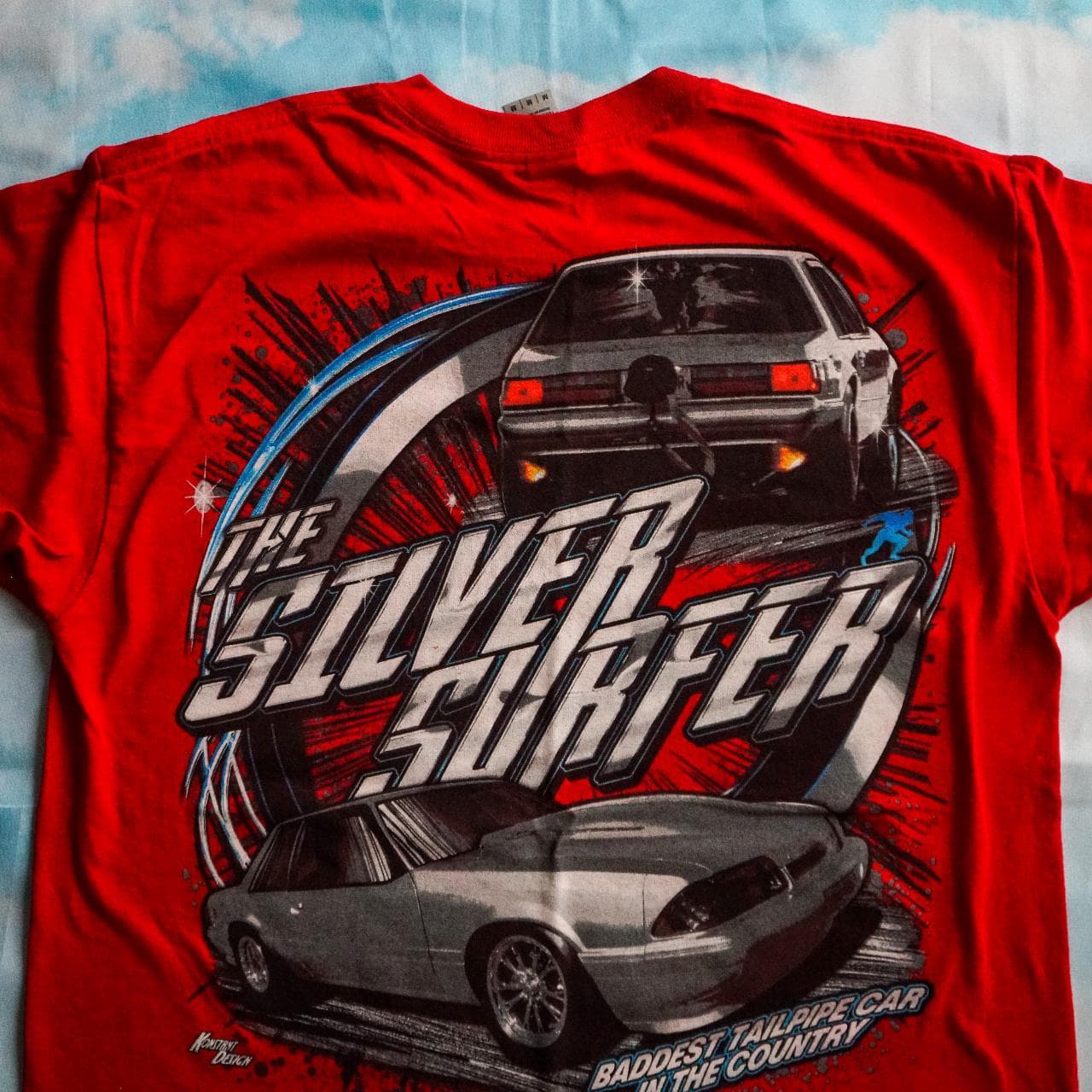 Silver Surfer street racing tee in red with black, blue, and silver accents. Features full-color graphics on the front and back 🏎 Adult size large. - Thumbnail 4