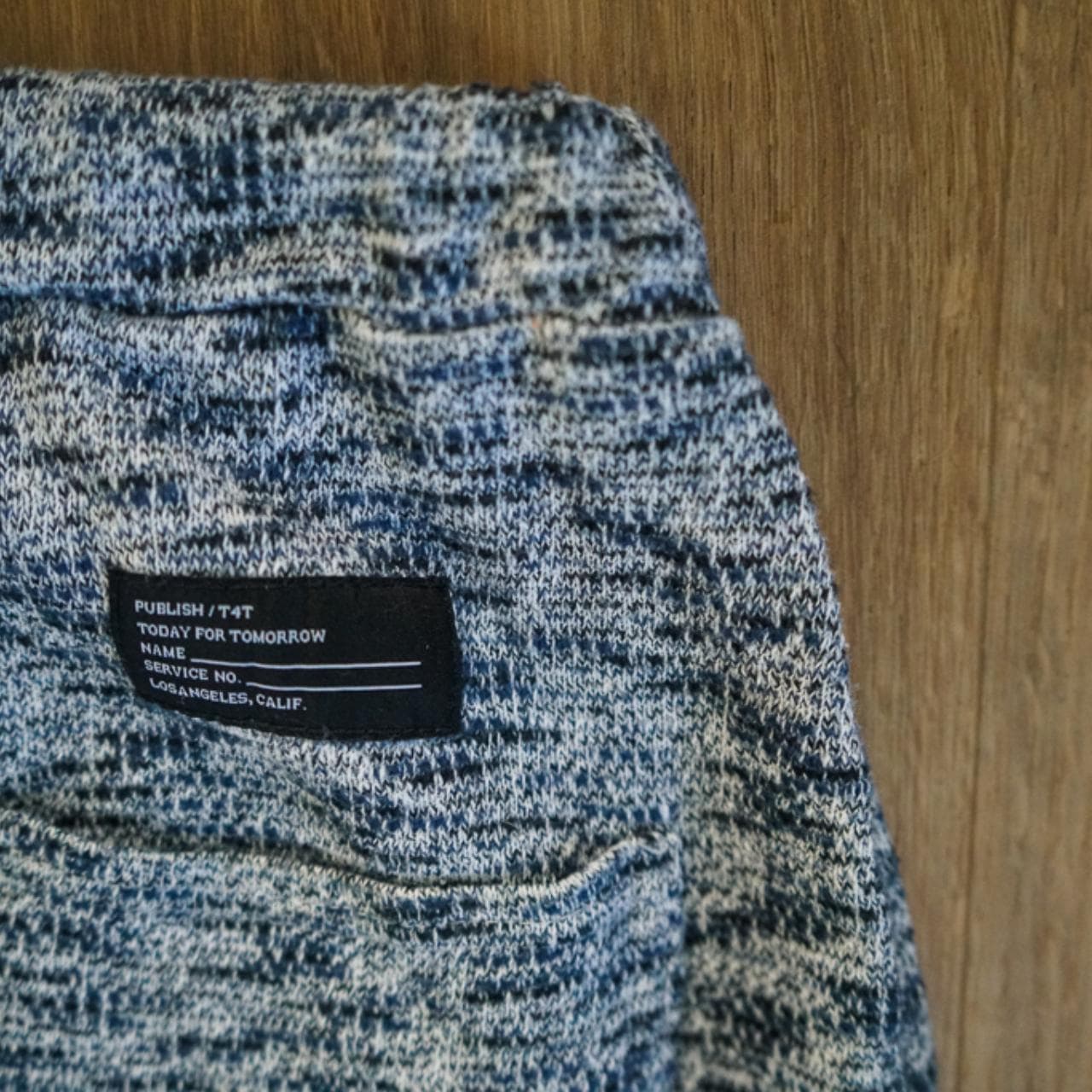 #Publish sweatpants with adjustable drawstring in navy and gray heather. Logo on front right pocket and patch on back right. Woven stretchable fabric with elastic drawstring and ankles. Men's size 30. #cozy - Thumbnail 4