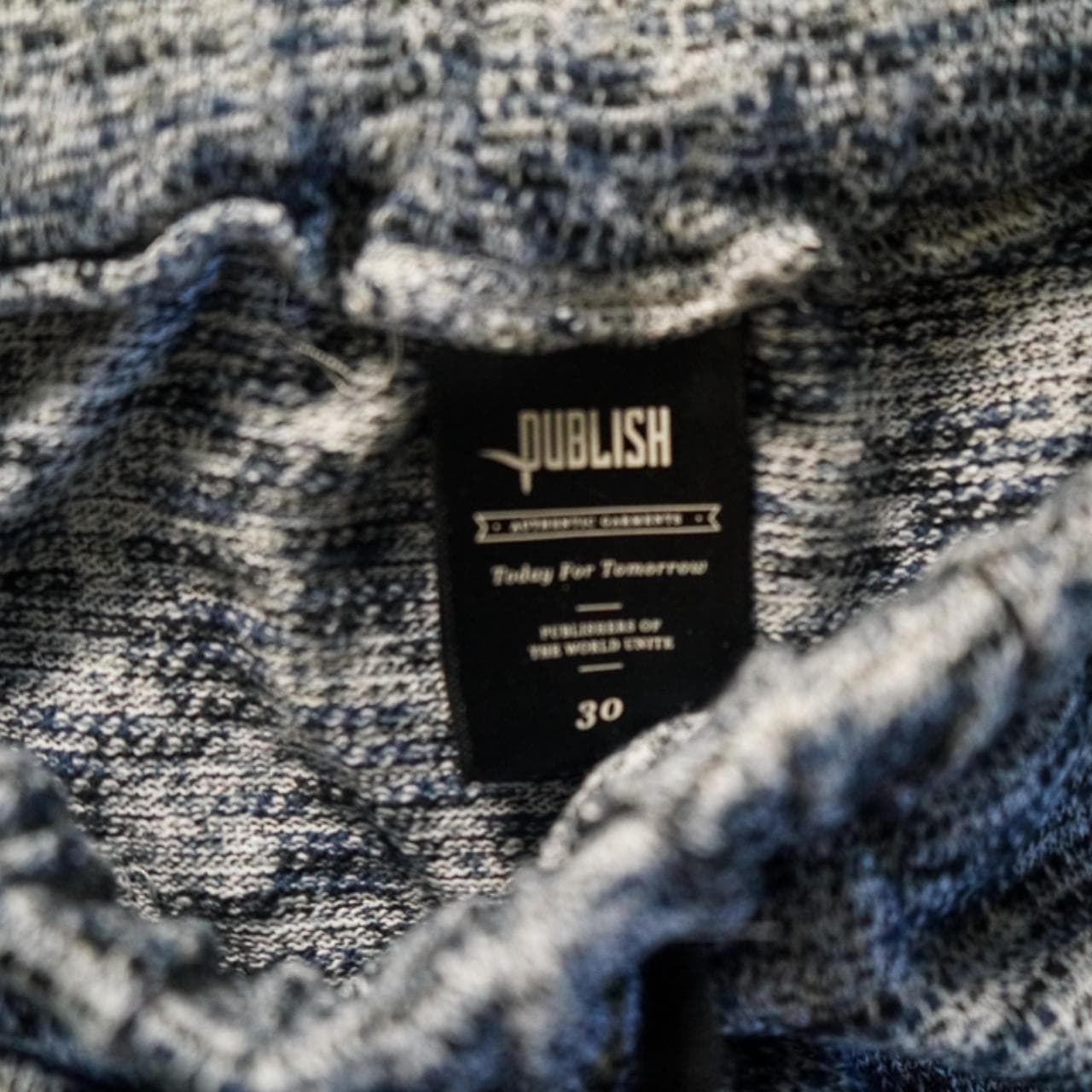#Publish sweatpants with adjustable drawstring in navy and gray heather. Logo on front right pocket and patch on back right. Woven stretchable fabric with elastic drawstring and ankles. Men's size 30. #cozy - Thumbnail 2