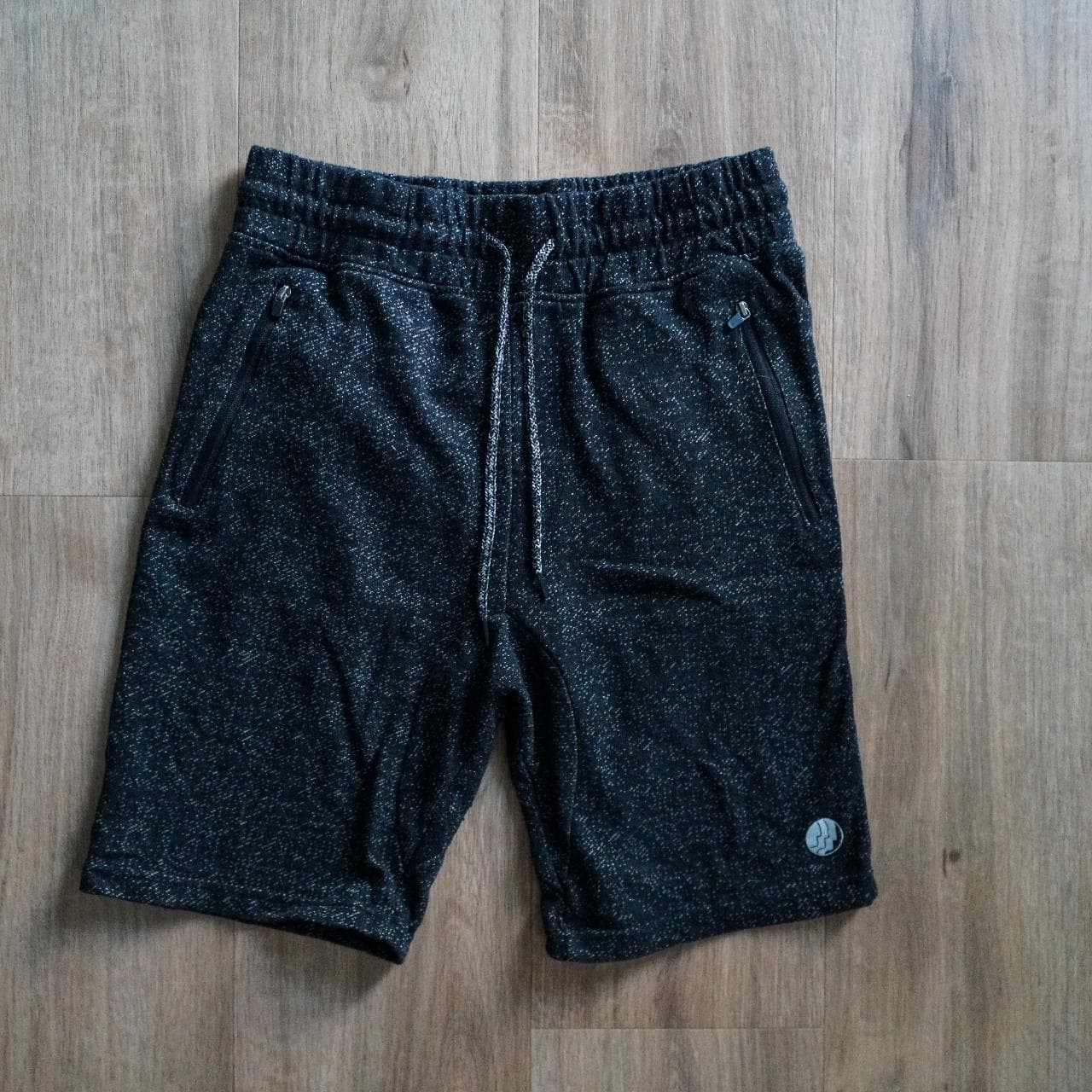 Heathered black shorts by #BKLYN. Shorts feature a drawstring, zippered pockets on front, and one back pocket 🪀 Size adult small.