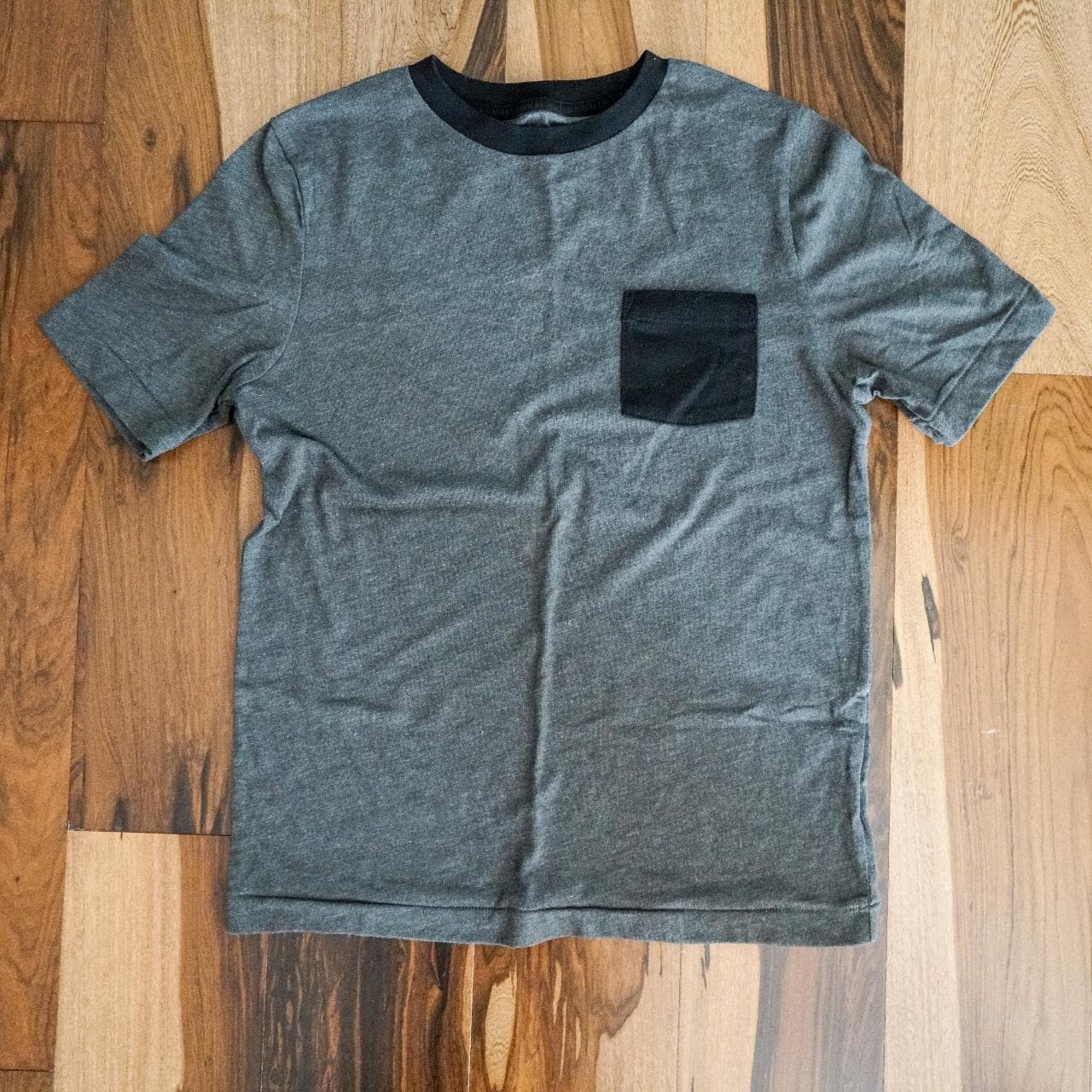 Simple grey and black pocket tee. Heather gray with contrasting pocket and collar.