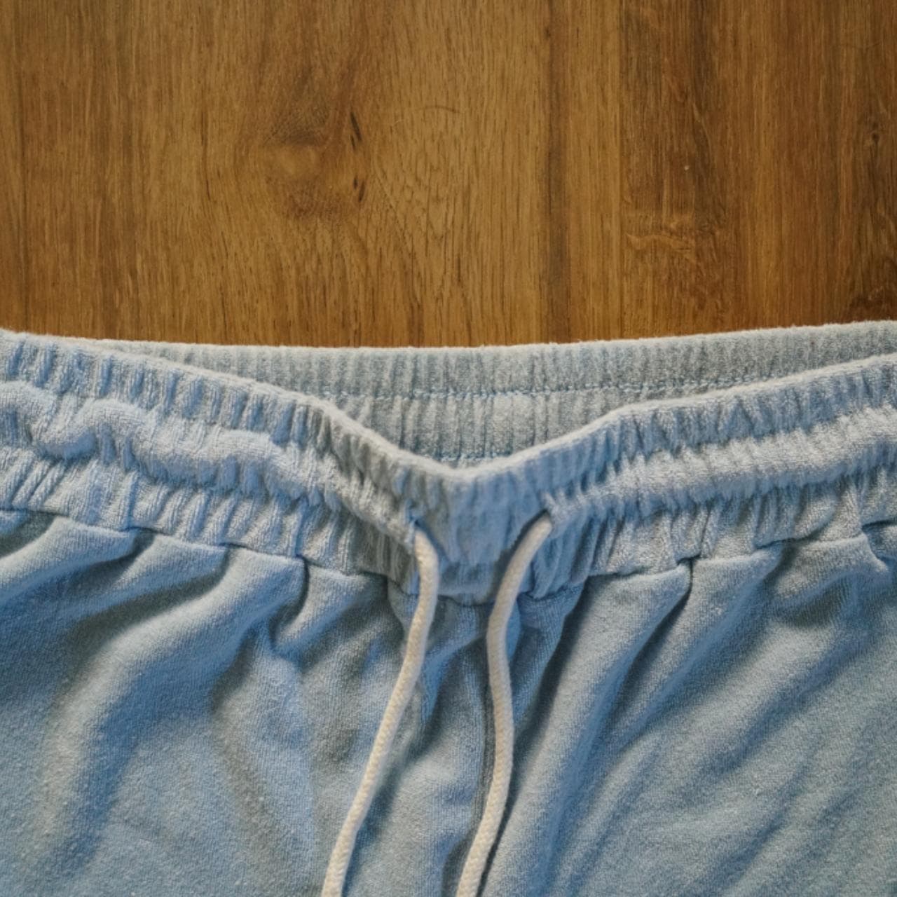 Light blue #terrycloth sweatpants with adjustable metal tipped drawstring. Jogger style ankle with pockets on the front. - Thumbnail 2