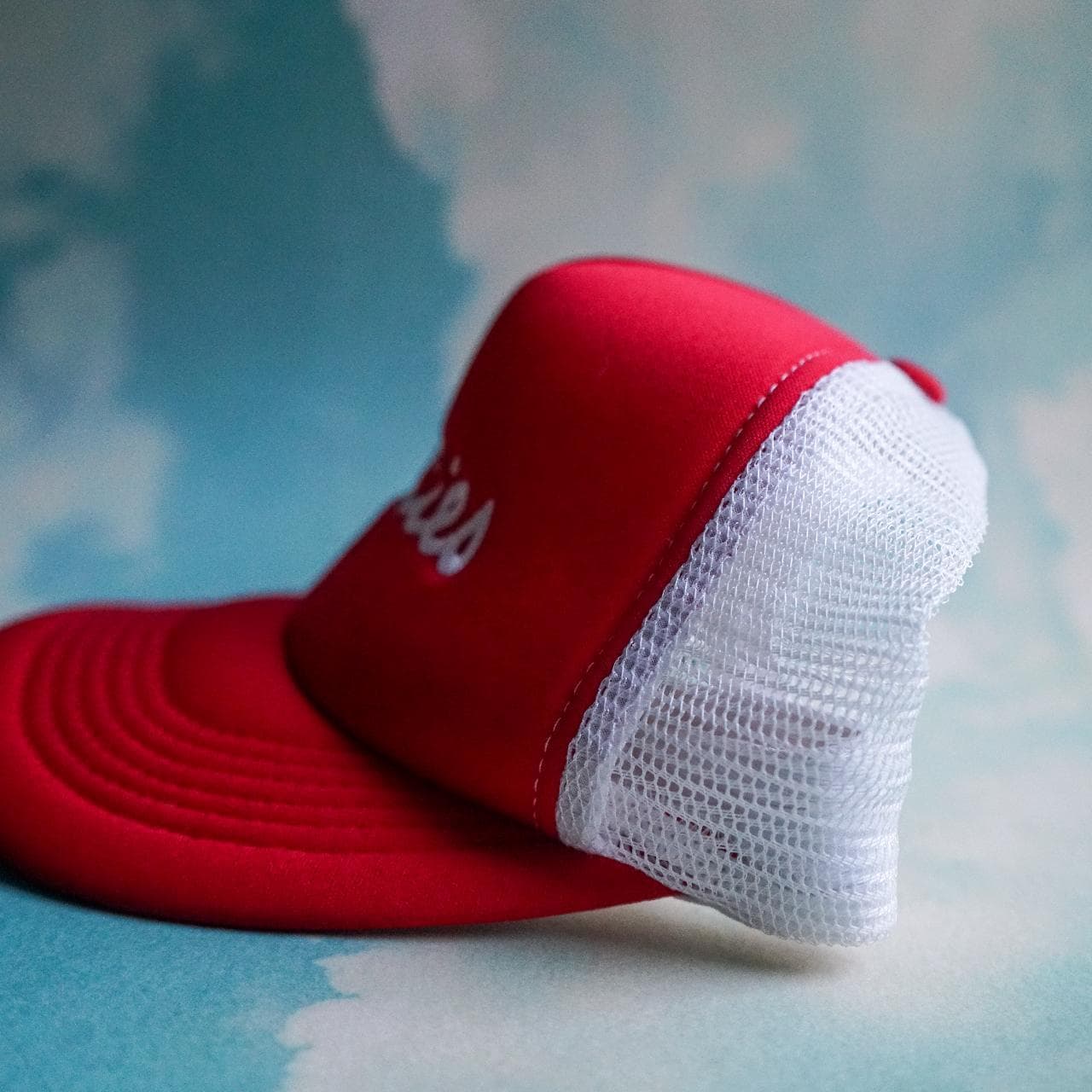 "Titties 2" trucker hat in red and white. Structured dome. Snap closure, red under brim, one size fits all. - Thumbnail 2
