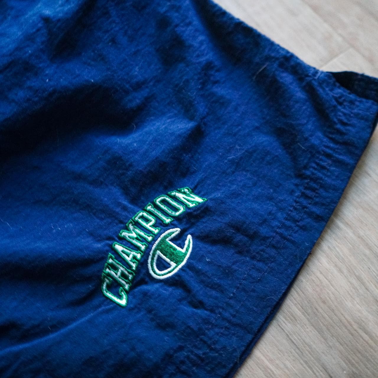 Navy #Champion shorts/swim trunks with sewn-on logo in kelly green and white 🍀 Shorts feature an inner liner, drawstring, and front pockets. Size adult small. - Thumbnail 2