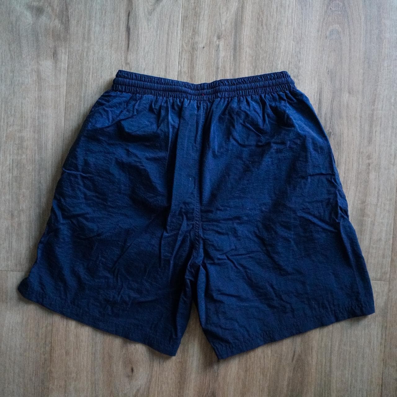 Navy #Champion shorts/swim trunks with sewn-on logo in kelly green and white 🍀 Shorts feature an inner liner, drawstring, and front pockets. Size adult small. - Thumbnail 4