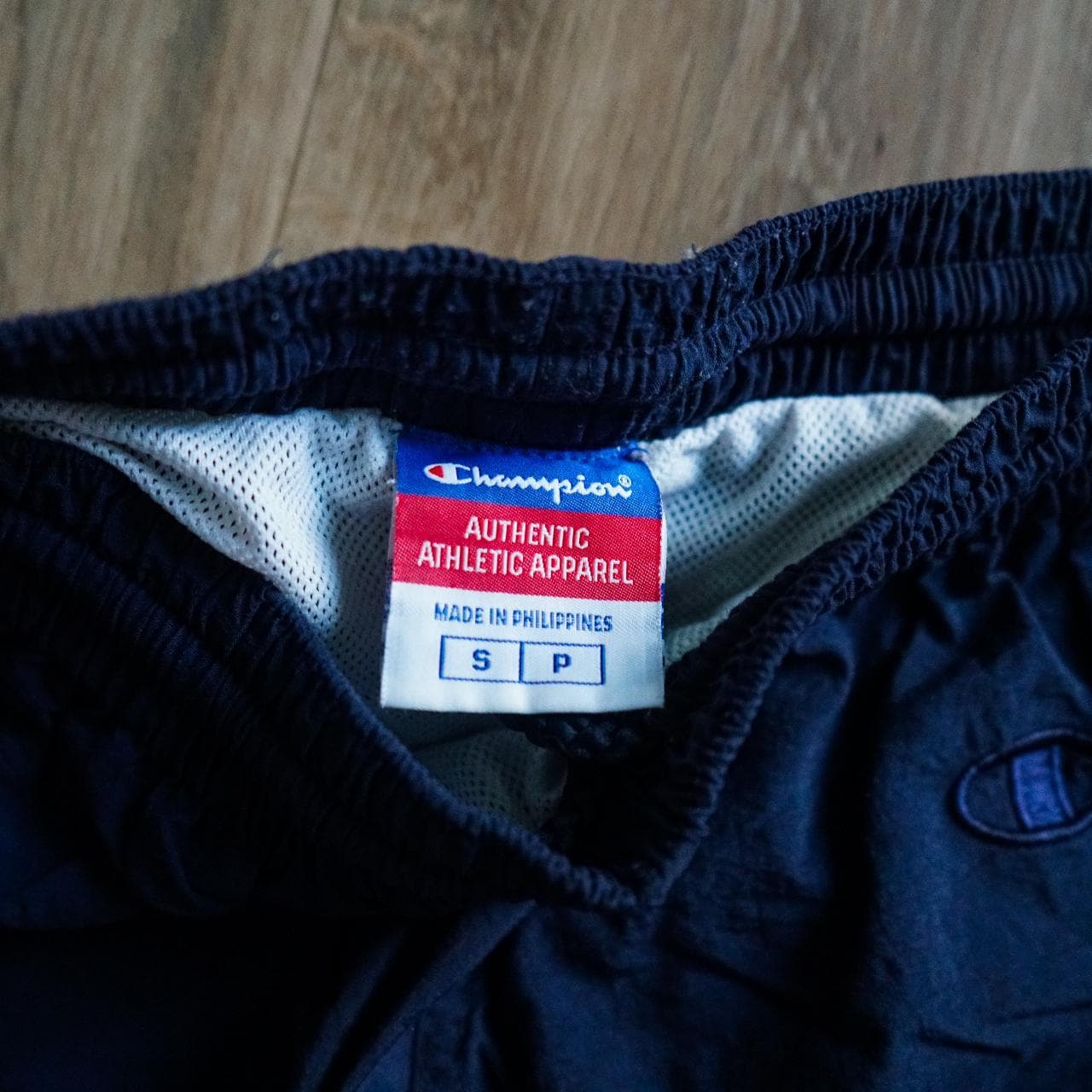 Navy #Champion shorts/swim trunks with sewn-on logo in kelly green and white 🍀 Shorts feature an inner liner, drawstring, and front pockets. Size adult small. - Thumbnail 3