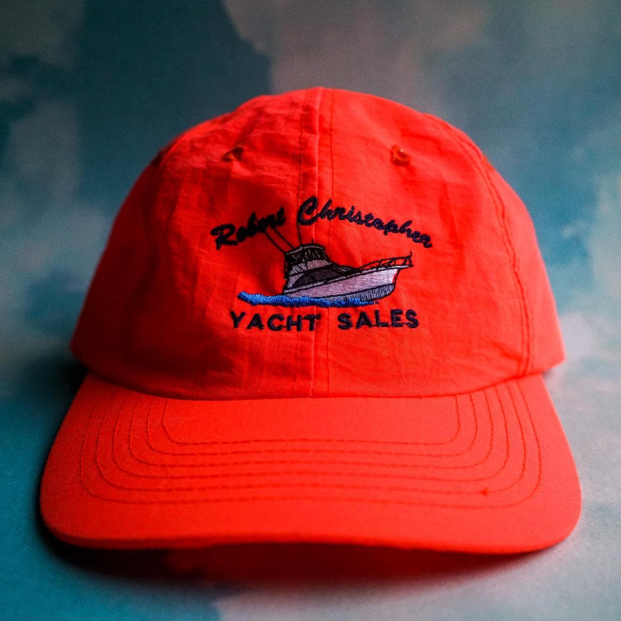 Vintage "Robert Christopher Yacht Sales" nylon hat with adjustable loop closure. Bright neon orange.
