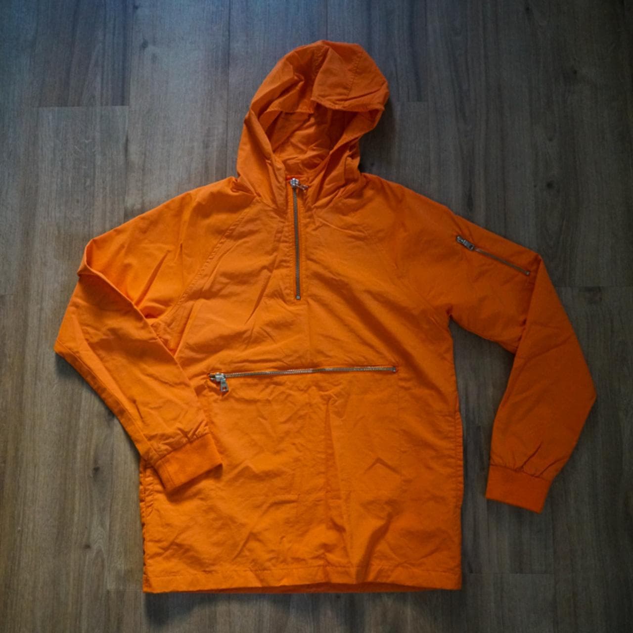 Bright #orange #anorak with silver zippers 🍊 Half-zip, front pocket, and pocket on the left sleeve.