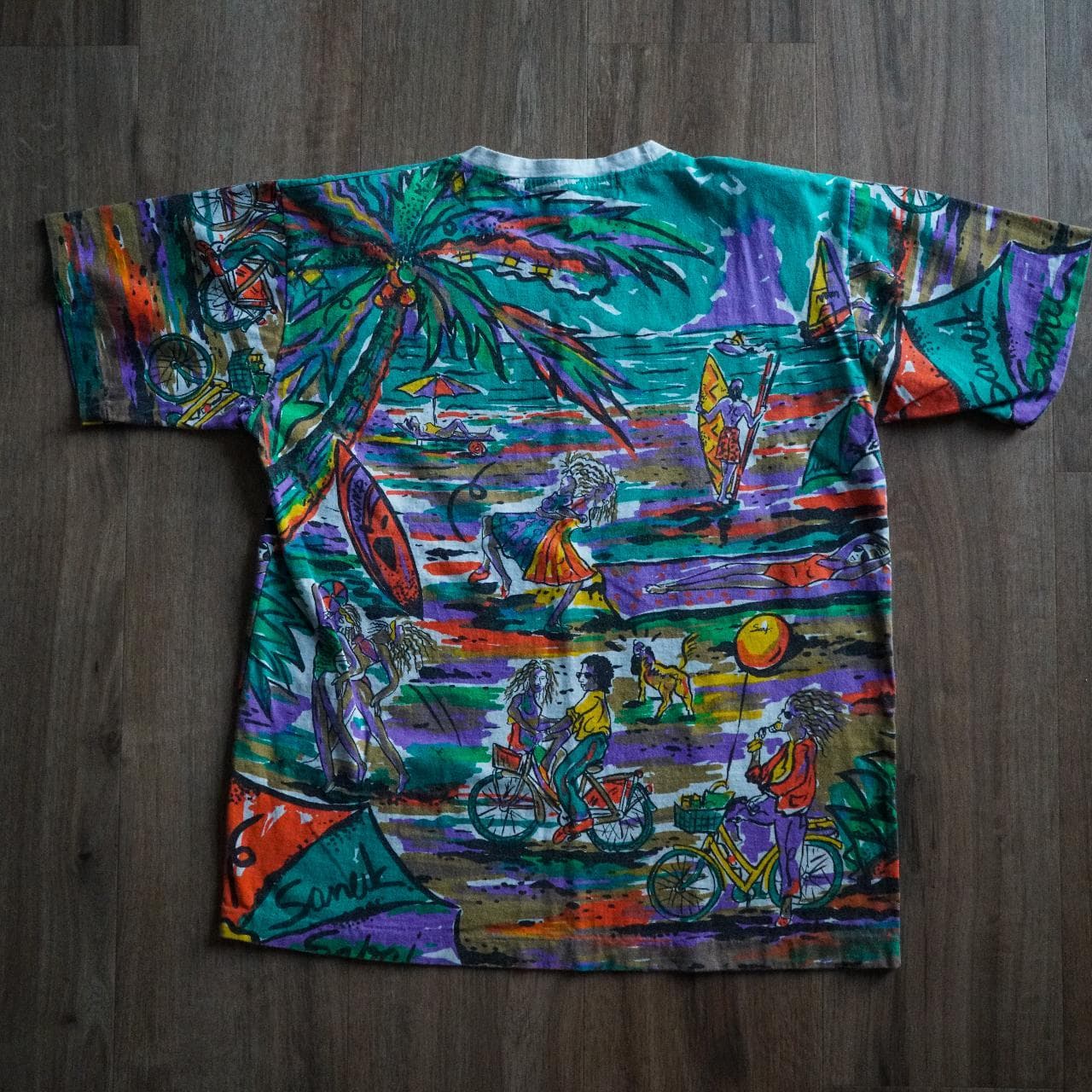 Vintage all-over print tee in vibrant multi-color. The shirt depicts a tropical beach scene. Size adult medium. - Thumbnail 4