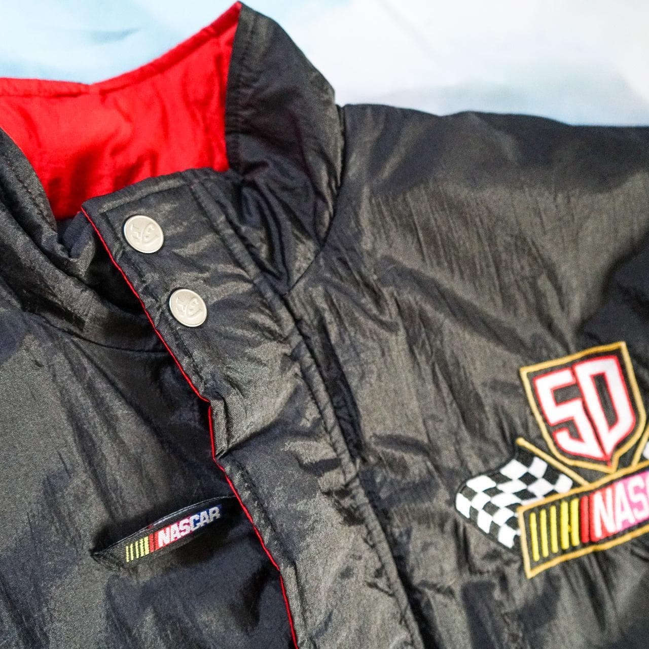 1998, 50th Anniversary #NASCAR insulated jacket. Features a black and gold base with red accents and embroidered graphics on the front chest and back. Snap and zip closures with front pockets 🏎 Size small, fits oversized. - Thumbnail 4