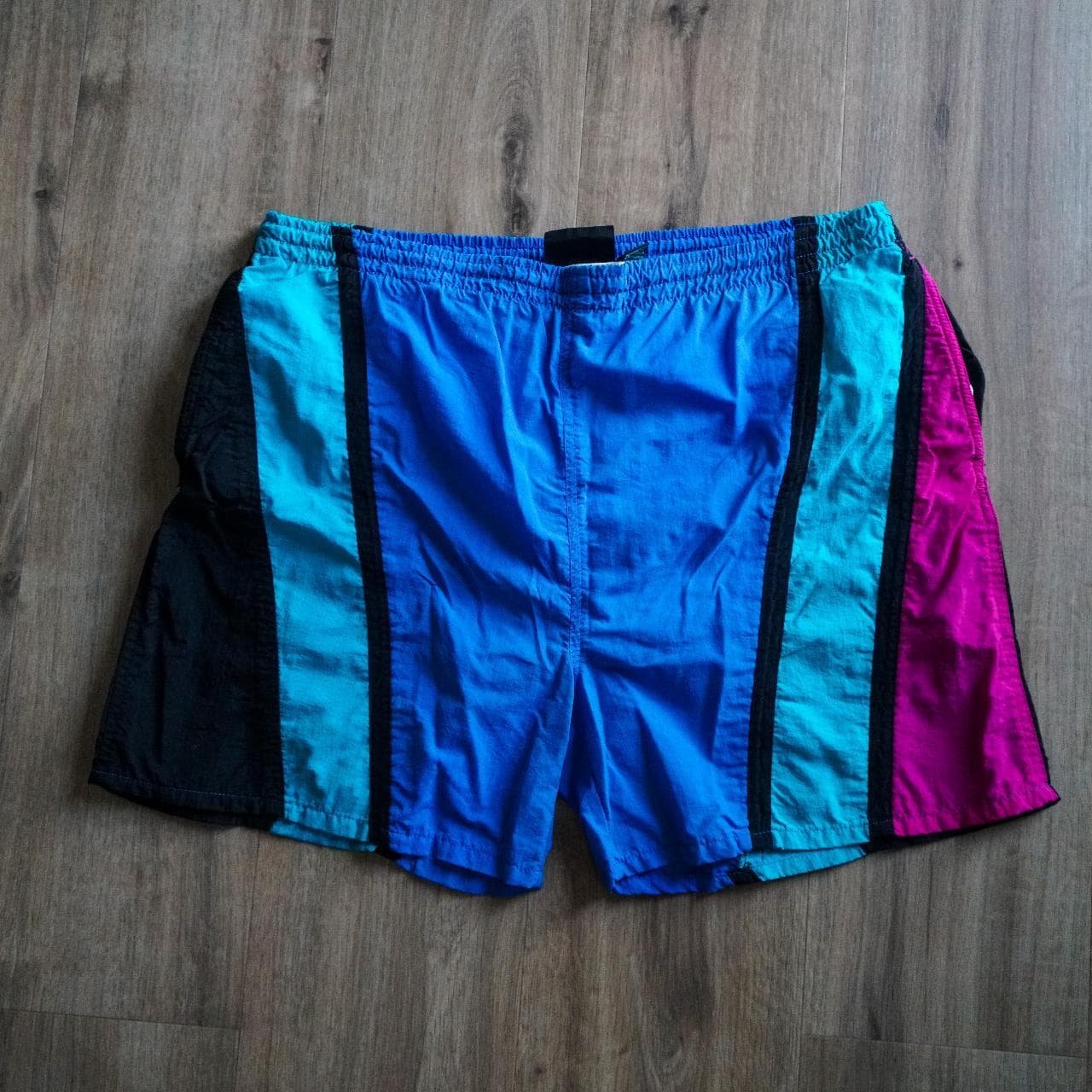 Surf Odyssey vintage swim trunks 🩳 Features 90s abstract stripes in blue, turquoise, purple, and black. Includes inner lining and drawstring.