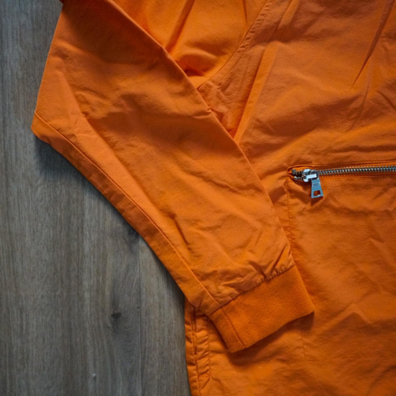 Bright #orange #anorak with silver zippers 🍊 Half-zip, front pocket, and pocket on the left sleeve. - Thumbnail 2