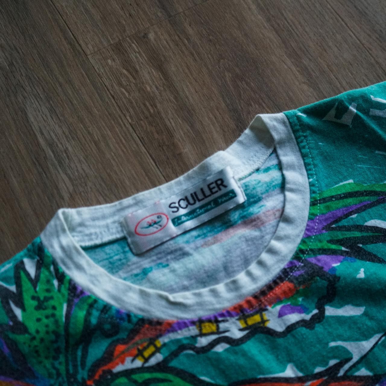 Vintage all-over print tee in vibrant multi-color. The shirt depicts a tropical beach scene. Size adult medium. - Thumbnail 2