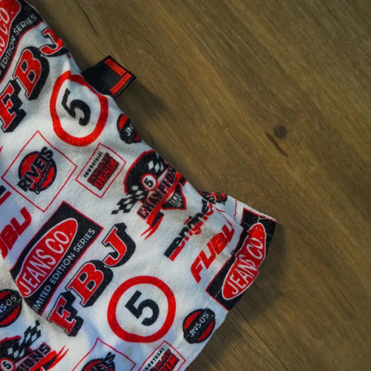 Vintage #FUBU short sleeved button up in Men's XL. All over print in red, white, and black. FUBU branding throughout. #90s #raptee - Thumbnail 3