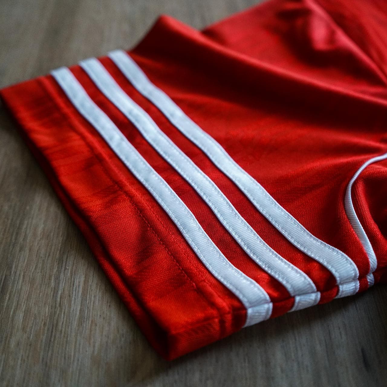 Vintage #Adidas soccer jersey in silky red ⚽️ Features 3-stripes on sleeves, white piping accents, Adidas logo in the middle, and repeating Adidas pattern throughout. - Thumbnail 3