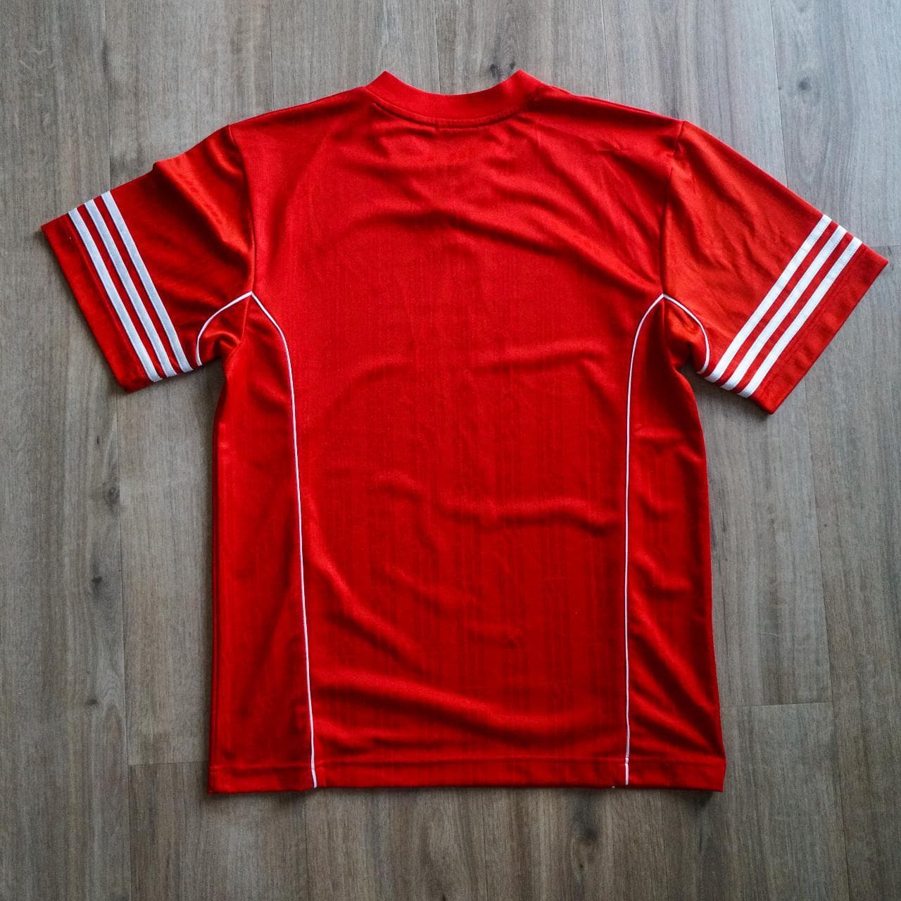 Vintage #Adidas soccer jersey in silky red ⚽️ Features 3-stripes on sleeves, white piping accents, Adidas logo in the middle, and repeating Adidas pattern throughout. - Thumbnail 4