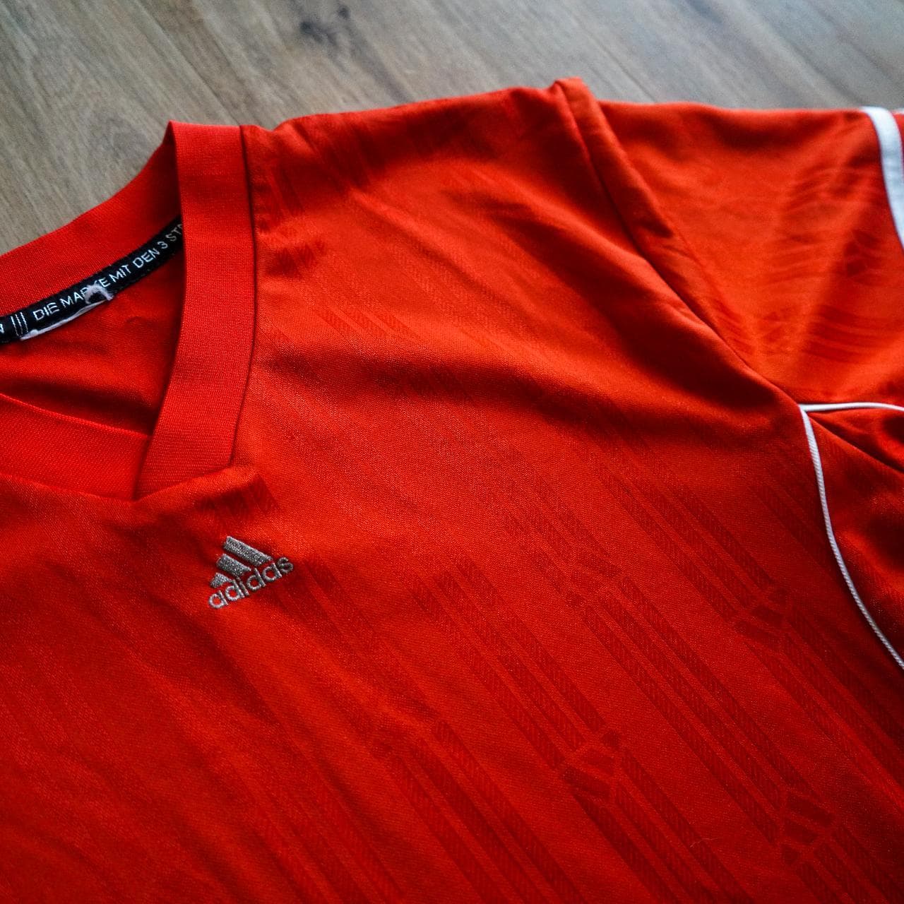 Vintage #Adidas soccer jersey in silky red ⚽️ Features 3-stripes on sleeves, white piping accents, Adidas logo in the middle, and repeating Adidas pattern throughout. - Thumbnail 2