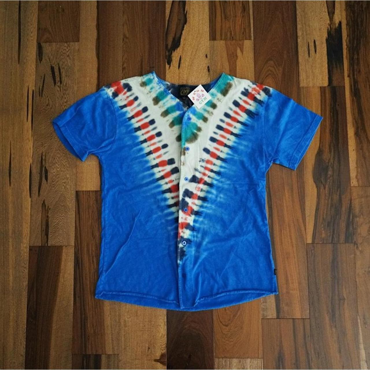 Obey Propaganda tie-dye baseball jersey. Blue, orange, white and green tie-dye with front buttons. Men’s Size Small.