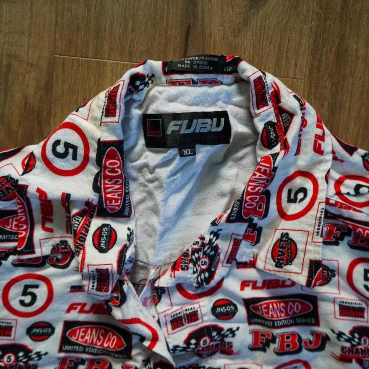 Vintage #FUBU short sleeved button up in Men's XL. All over print in red, white, and black. FUBU branding throughout. #90s #raptee - Thumbnail 2