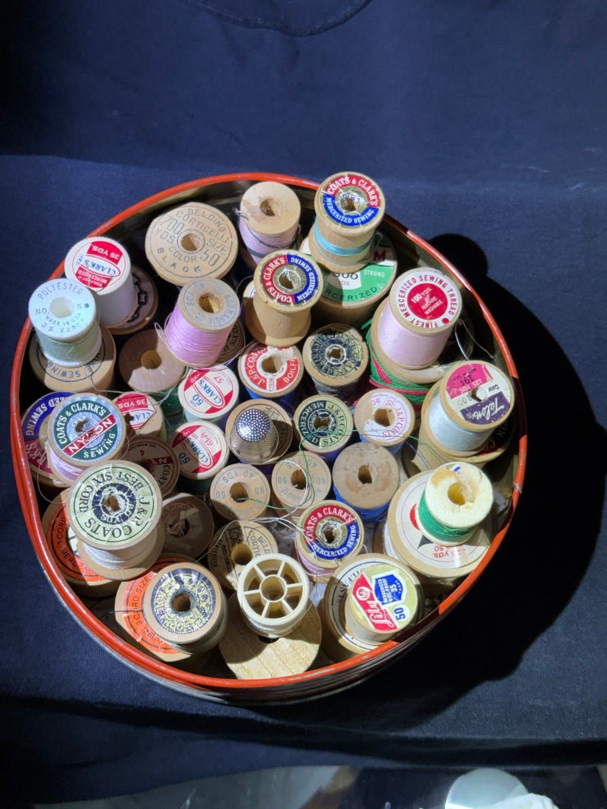 Vintage wooden spools with thread.