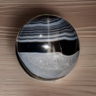 Polished Black Banded Agate Crystal Sphere with Druzy Section Display Specimen - Thumbnail 4
