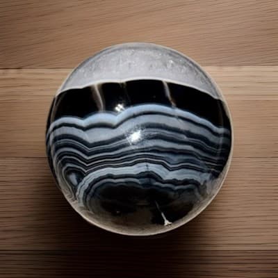 Polished Black Banded Agate Crystal Sphere with Druzy Section Display Specimen - Thumbnail 3