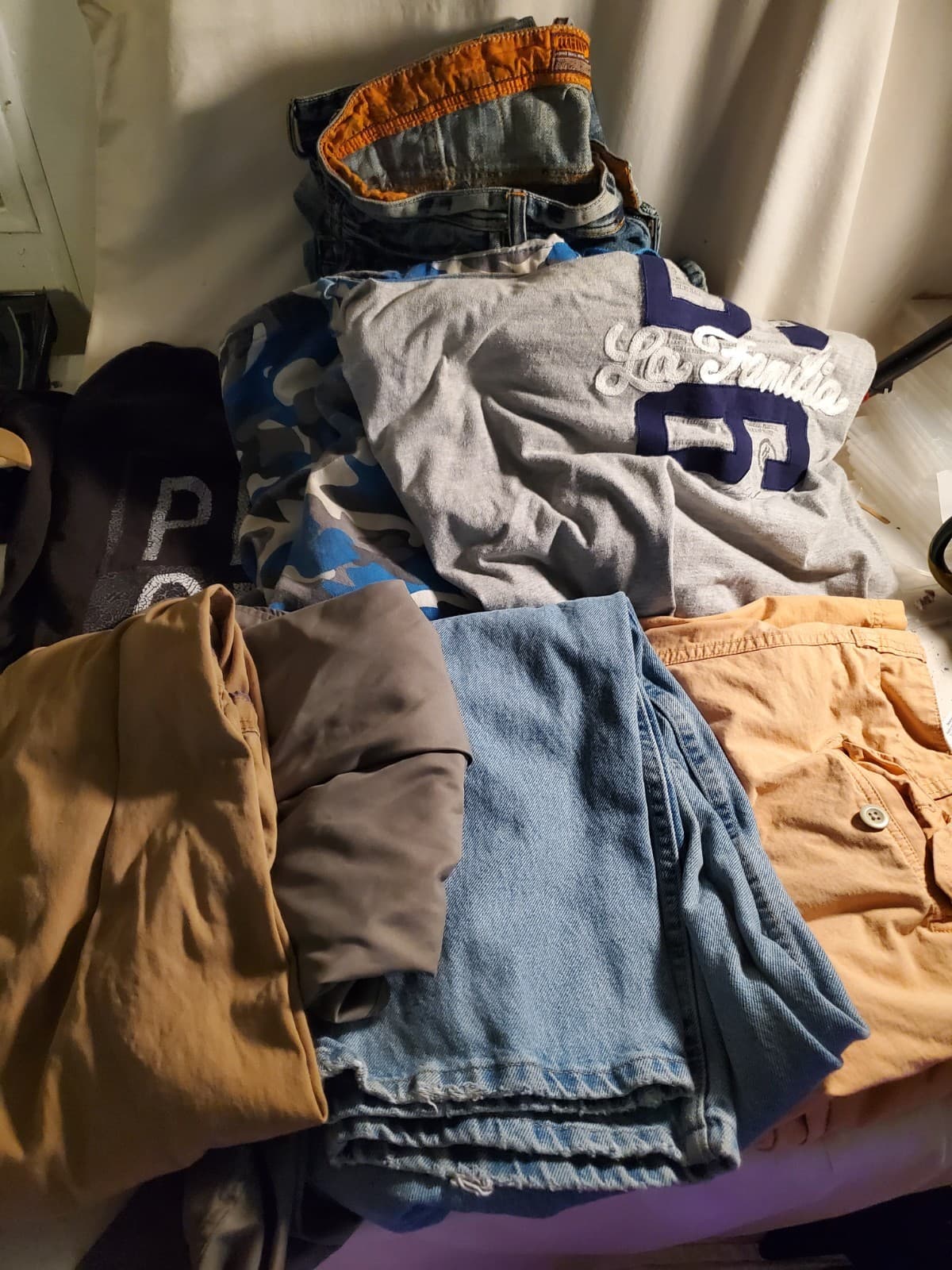 Lot of stained/lightly damaged clothing - J. Henry, Evolution, Rocawear, more