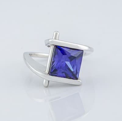 SVG 925 SILVER BYPASS WITH SIMULATED OR LAB CREATED TANZANITE - SIZE 5 1/2