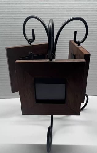 Cute Set Of Three Small Brown Wood Frames That Have A Black Metal Stand