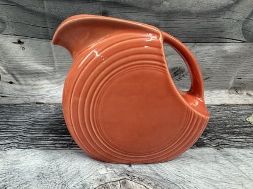 Fiesta ware Persimmon Water Disc Pitcher Fiesta HLC USA Homer Laughlin 7"