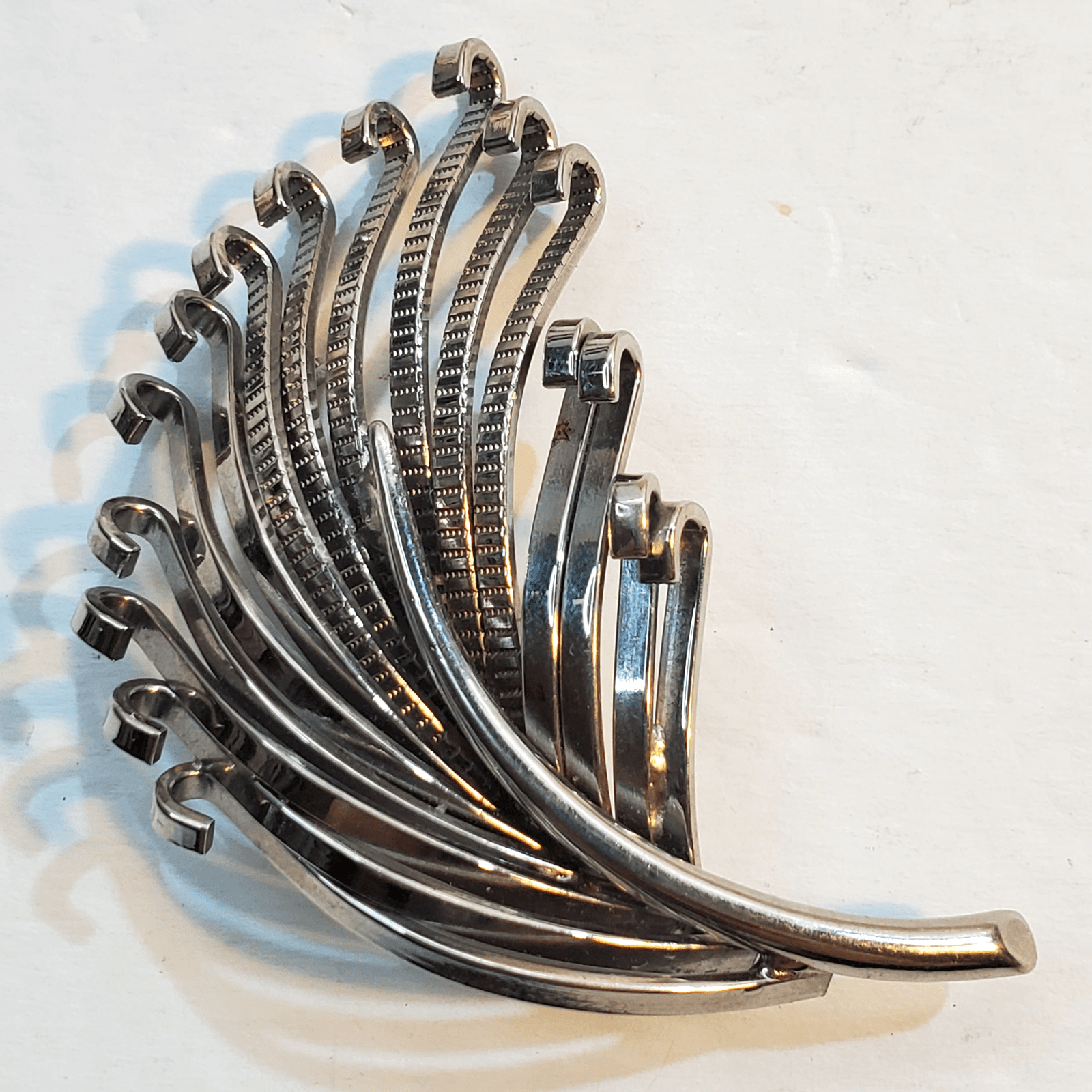 Vintage Silver Tone Metal Leafy Feather Looking Curled Open Work Brooch Pin