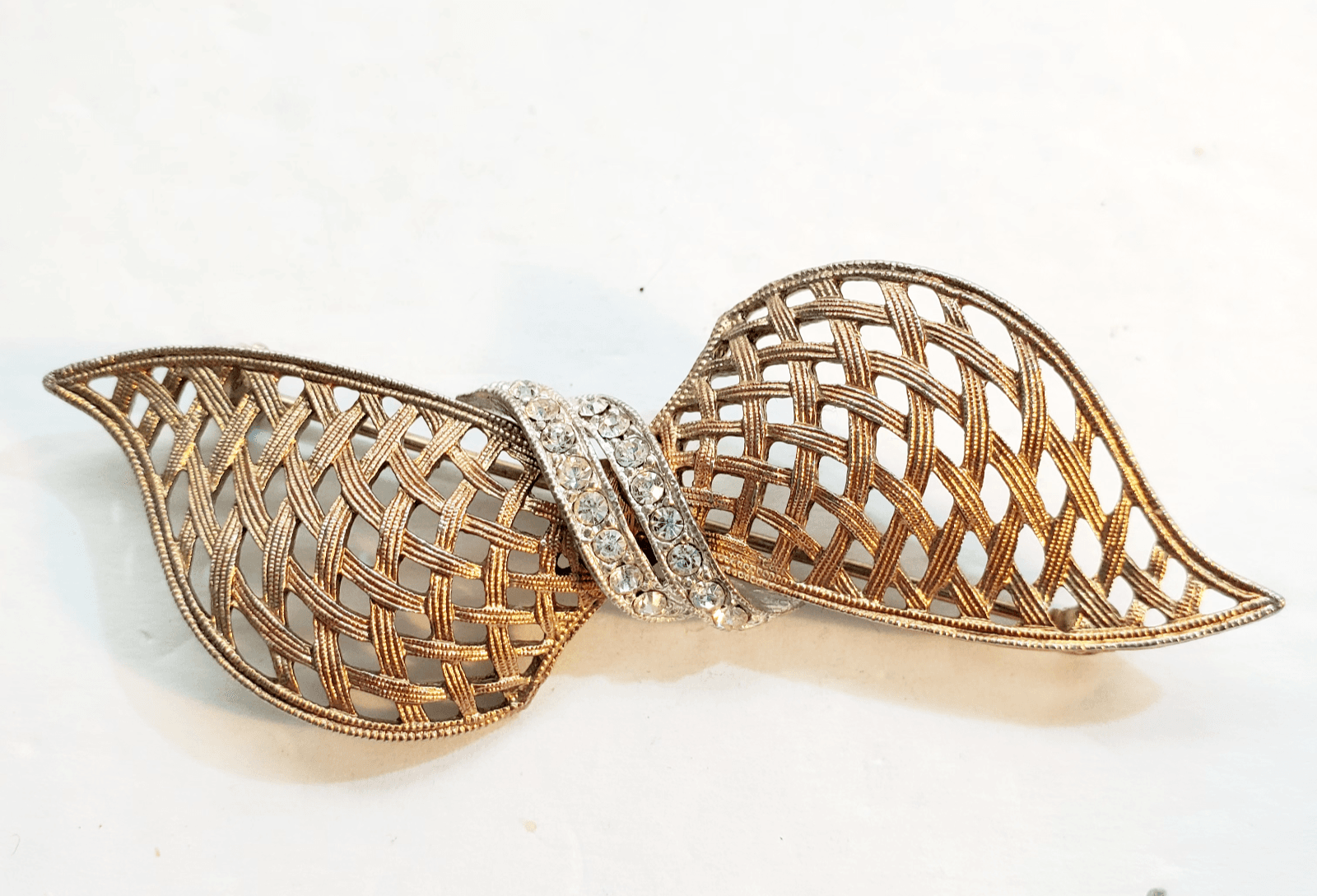 Vtg JJ Jonette Brass Tone Clear Rhinestones Openwork Weave Knot Bow Brooch Pin