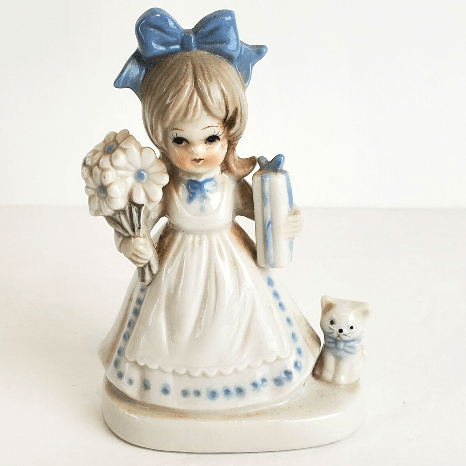 Vintage Enesco Girl holding flowers present standing with kitten 4.5” Figurine