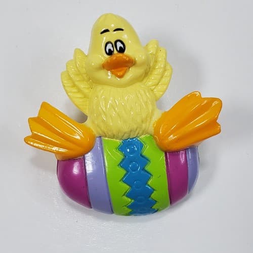 Vintage Plastic Yellow Duck Sitting On a Colorful Easter Egg Spring Brooch Pin