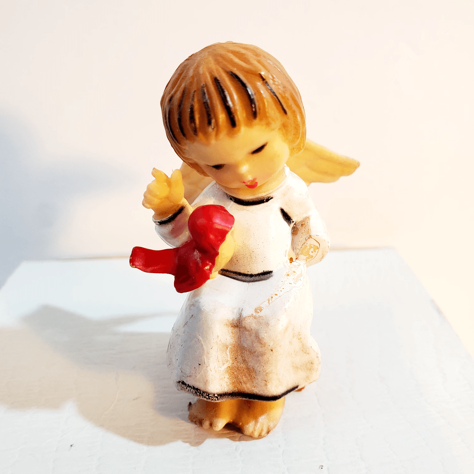 Vintage Plastic Angel Sitting and Holding Red Bird Ornament MCM 2.25" Tall