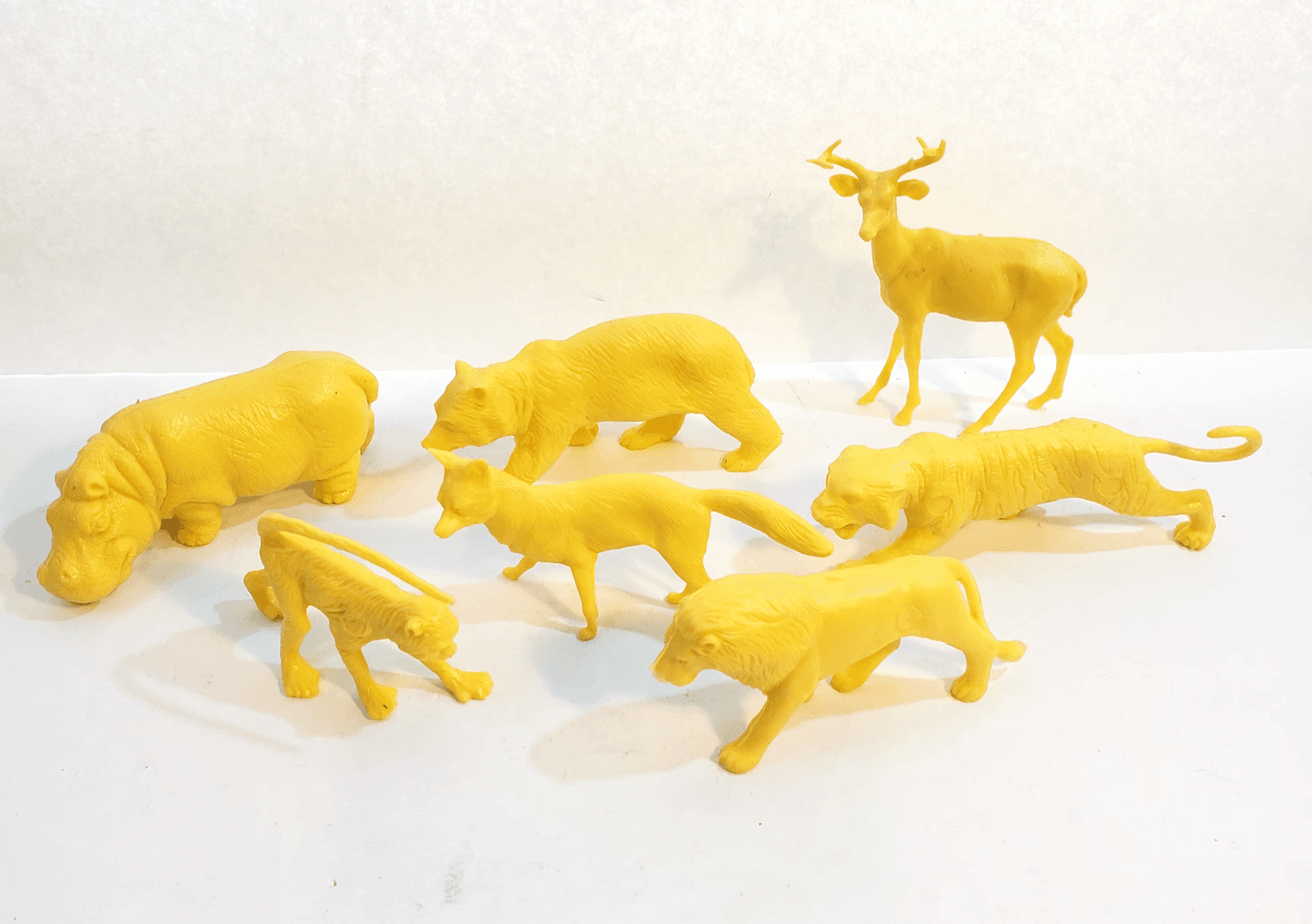 Lot of 7 Yellow Hard Molded Plastic Wild Animals Lion Monkey Fox Bear Hippo Deer